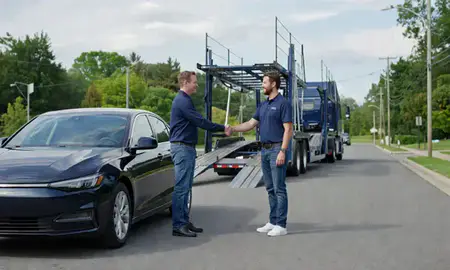 Vehicle owner beside their delivered car in Plum, Pennsylvania, United States