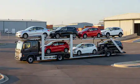 Car transporter loaded with vehicles in Plum, Pennsylvania, United States