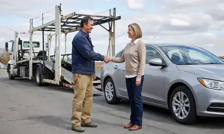 Vehicle owner beside their delivered car in Scranton, Pennsylvania, United States