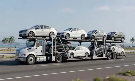 Multi-level car carrier on the highway to Puerto Rico, United States