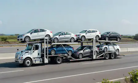 Multi-level car carrier on the highway to Aguadilla, Puerto Rico, United States