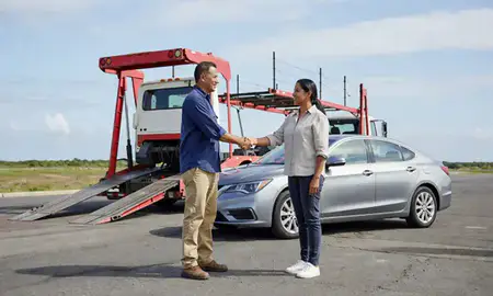 Vehicle owner beside their delivered car in Arecibo, Puerto Rico, United States