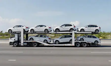 Multi-level car carrier on the highway to Cabo Rojo, Puerto Rico, United States
