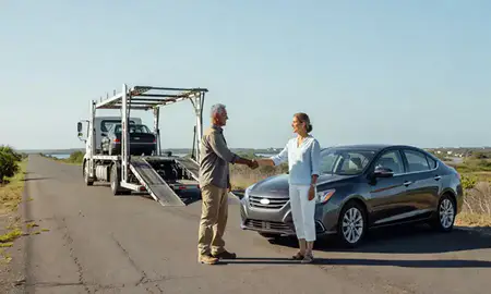 Vehicle owner beside their delivered car in Cabo Rojo, Puerto Rico, United States