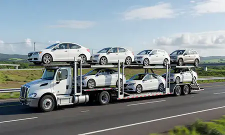 Multi-level car carrier on the highway to Caguas, Puerto Rico, United States