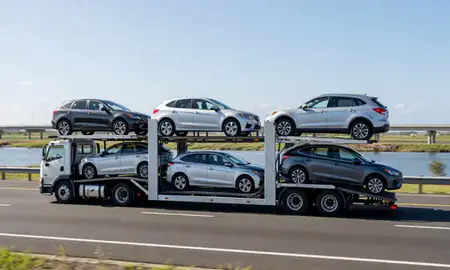 Multi-level car carrier on the highway to Caño Martin Peña, Puerto Rico, United States