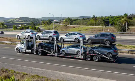 Multi-level car carrier on the highway to Carolina, Puerto Rico, United States