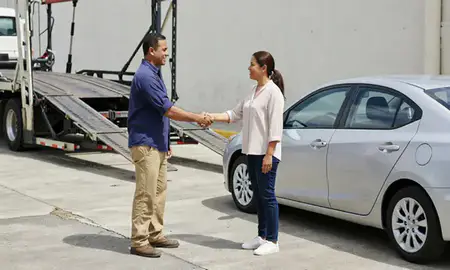 Vehicle owner beside their delivered car in Cataño, Puerto Rico, United States