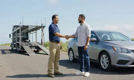 Vehicle owner beside their delivered car in Dorado, Puerto Rico, United States