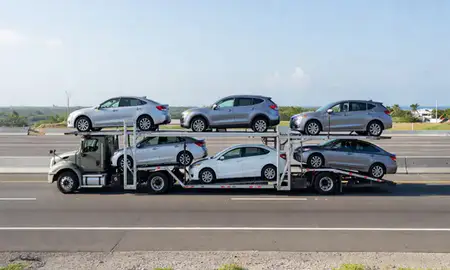 Multi-level car carrier on the highway to Fajardo, Puerto Rico, United States