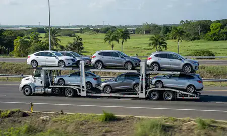 Multi-level car carrier on the highway to Guaynabo, Puerto Rico, United States