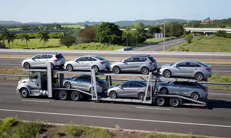 Multi-level car carrier on the highway to Humacao, Puerto Rico, United States