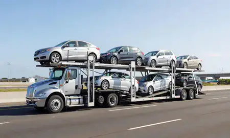 Multi-level car carrier on the highway to Isabela, Puerto Rico, United States