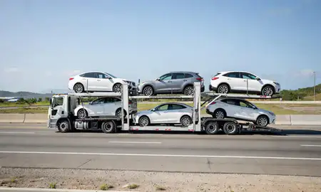 Multi-level car carrier on the highway to Juana Díaz, Puerto Rico, United States