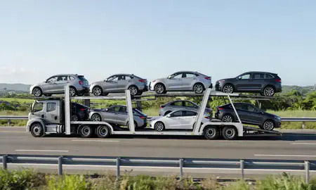 Multi-level car carrier on the highway to Manatí, Puerto Rico, United States