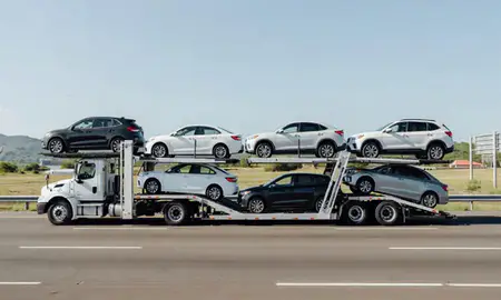 Multi-level car carrier on the highway to Ponce, Puerto Rico, United States