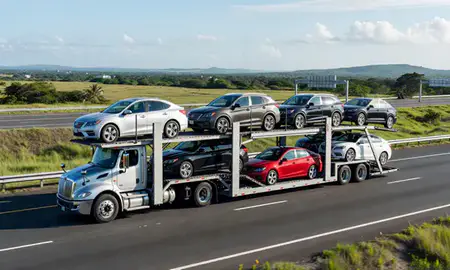 Multi-level car carrier on the highway to Río Grande, Puerto Rico, United States