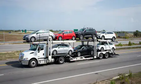 Multi-level car carrier on the highway to San Antonio, Puerto Rico, United States