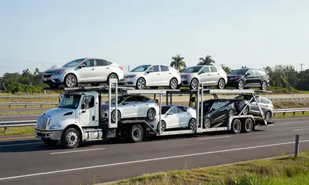 Multi-level car carrier on the highway to San Germán, Puerto Rico, United States