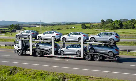 Multi-level car carrier on the highway to Trujillo Alto, Puerto Rico, United States