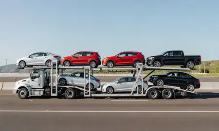 Multi-level car carrier on the highway to Yauco, Puerto Rico, United States