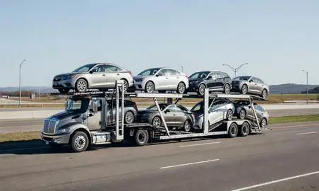 Multi-level car carrier on the highway to Rhode Island, United States
