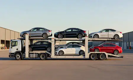 Car transporter parked in an industrial area of Bradford, Rhode Island, United States