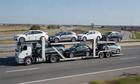 Multi-level car carrier on the highway to Carolina, Rhode Island, United States