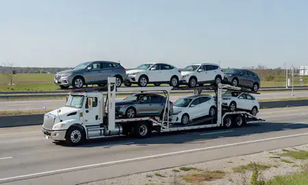 Multi-level car carrier on the highway to Central Falls, Rhode Island, United States