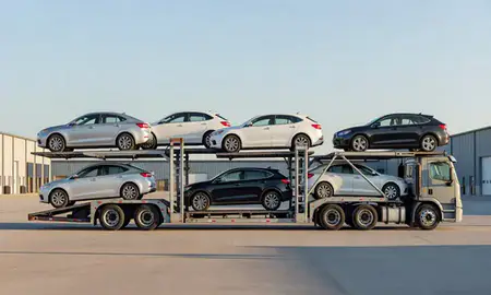 Car transporter parked in an industrial area of Central Falls, Rhode Island, United States