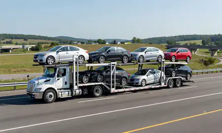 Multi-level car carrier on the highway to Chepachet, Rhode Island, United States