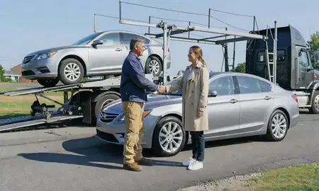 Vehicle owner beside their delivered car in Cumberland Hill, Rhode Island, United States