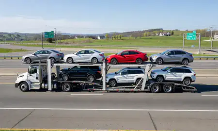 Multi-level car carrier on the highway to Greene, Rhode Island, United States
