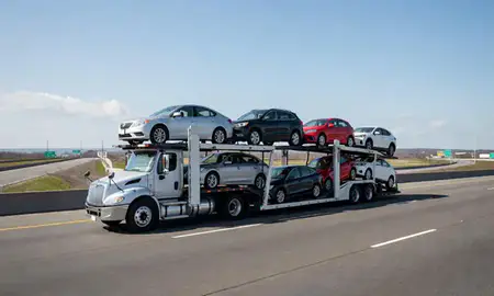 Multi-level car carrier on the highway to Greenville, Rhode Island, United States