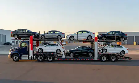 Car transporter parked in an industrial area of Greenville, Rhode Island, United States