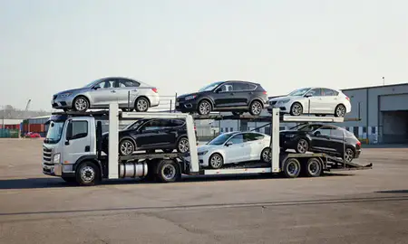 Car transporter loaded with vehicles in Greenville, Rhode Island, United States