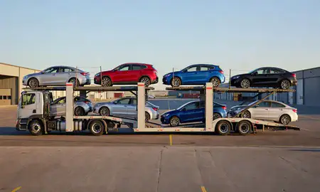 Car transporter parked in an industrial area of Misquamicut, Rhode Island, United States