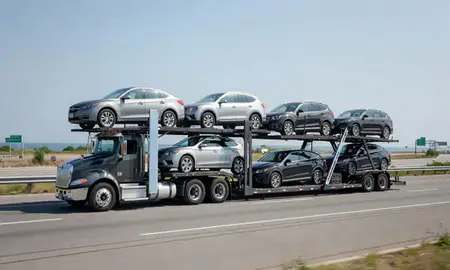 Multi-level car carrier on the highway to Narragansett Pier, Rhode Island, United States