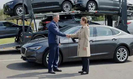Vehicle owner beside their delivered car in Newport, Rhode Island, United States