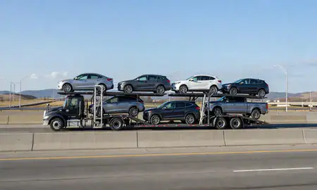 Multi-level car carrier on the highway to Providence, Rhode Island, United States