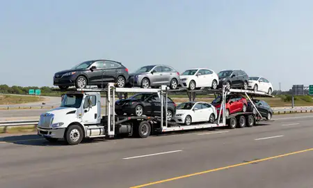 Multi-level car carrier on the highway to Warwick, Rhode Island, United States