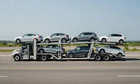 Multi-level car carrier on the highway to Watch Hill, Rhode Island, United States