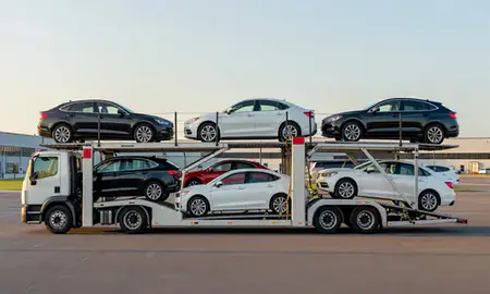 Car transporter parked in an industrial area of Watch Hill, Rhode Island, United States