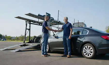 Vehicle owner beside their delivered car in Aiken, South Carolina, United States