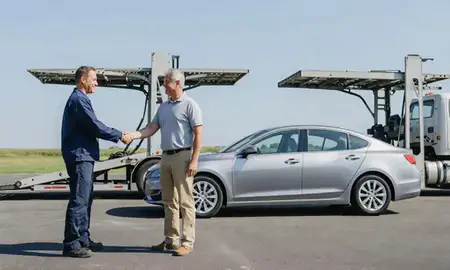 Vehicle owner beside their delivered car in Anderson, South Carolina, United States