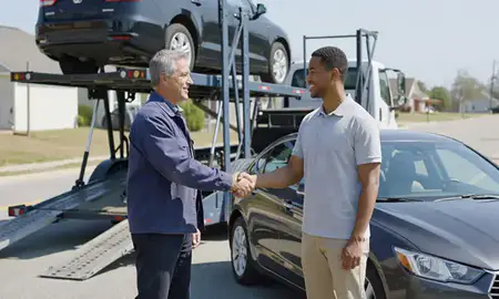 Vehicle owner beside their delivered car in Conway, South Carolina, United States