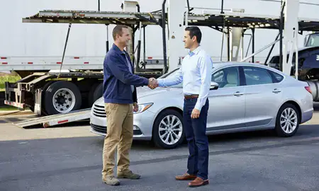 Vehicle owner beside their delivered car in Fort Mill, South Carolina, United States