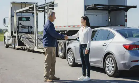 Vehicle owner beside their delivered car in Greenville, South Carolina, United States
