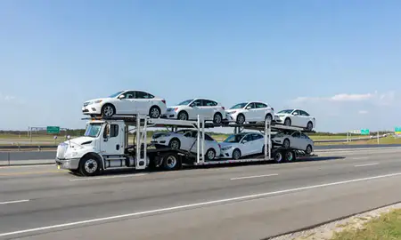 Multi-level car carrier on the highway to Lexington, South Carolina, United States