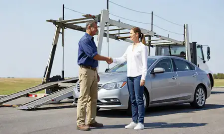 Vehicle owner beside their delivered car in Lexington, South Carolina, United States